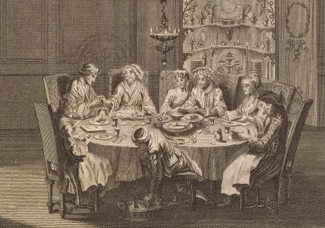 Czarno-biała grafika. Fragment pokoju. W centralnej części okrągły stół przykryty długim białym obrusem. Stół jest zastawiony naczyniami i potrawami. Przy stole kilka osób w różnym wieku podczas posiłku.